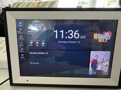 The finished frame showing weather, the time and date, today's calendar, what's playing on K-Country 93.7, and a family photo